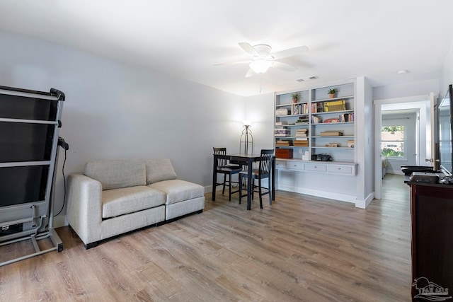 interior space with wood-type flooring and ceiling fan