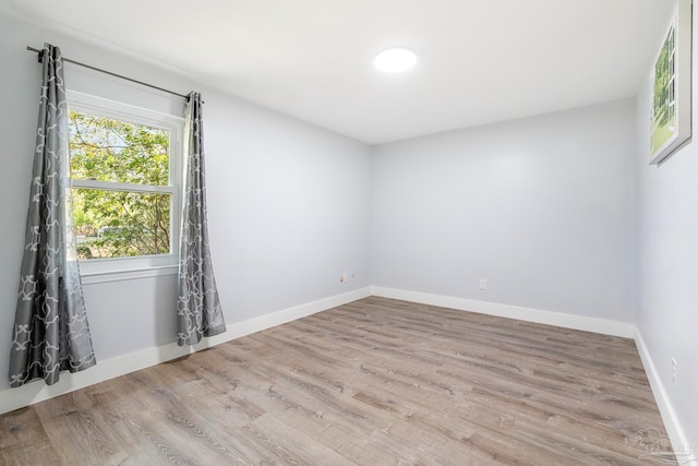 spare room with light wood-type flooring