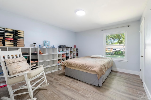 bedroom with wood-type flooring