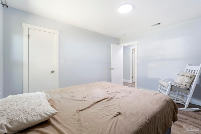 bedroom with light wood-type flooring