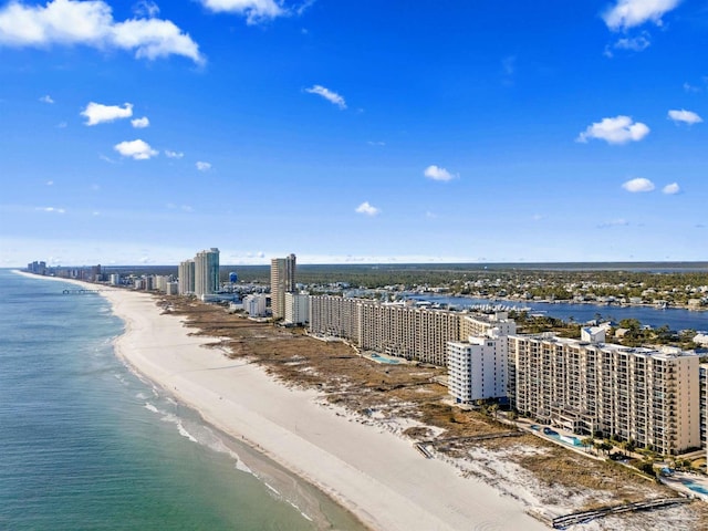 drone / aerial view featuring a water view and a beach view