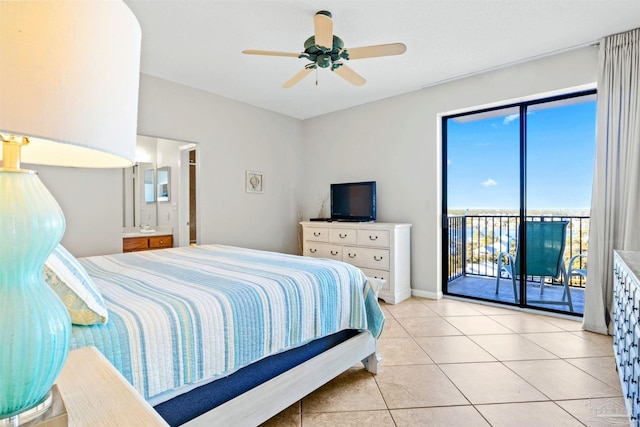 tiled bedroom with ceiling fan, ensuite bath, and access to exterior