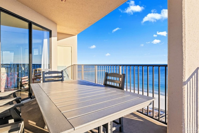 balcony featuring a water view