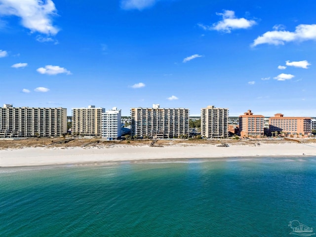 aerial view featuring a view of the beach and a water view