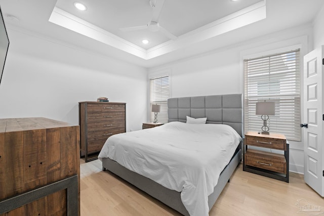 1550 W Romana St, Pensacola, FL 32502 - bedroom featuring light wood-style flooring, a tray ceiling, ceiling fan, ornamental molding, and recessed lighting