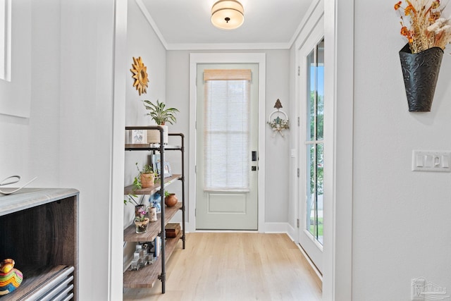 1550 W Romana St, Pensacola, FL 32502 - foyer with light wood-style floors, crown molding, and baseboards