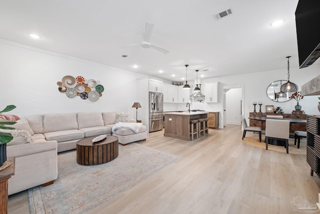 1550 W Romana St, Pensacola, FL 32502 - living room with crown molding, ceiling fan, recessed lighting, and light wood-type flooring