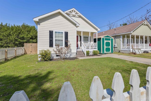 view of front of house featuring covered porch, crawl space, a front yard, and fence