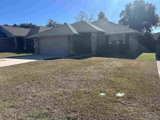 ranch-style house with a garage and a front lawn