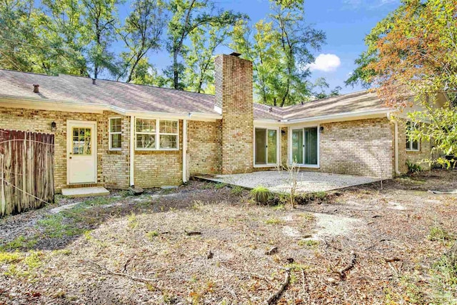 rear view of property with a patio area