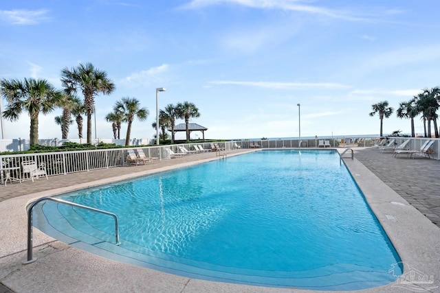 view of swimming pool with a patio