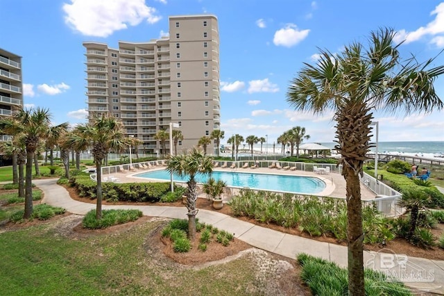 view of pool featuring a water view