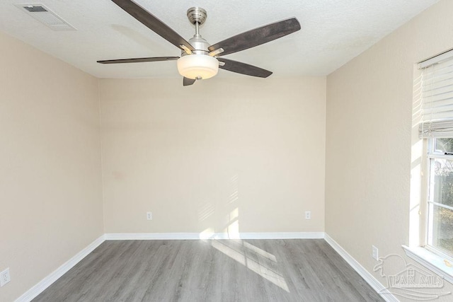 empty room featuring ceiling fan and light wood-type flooring