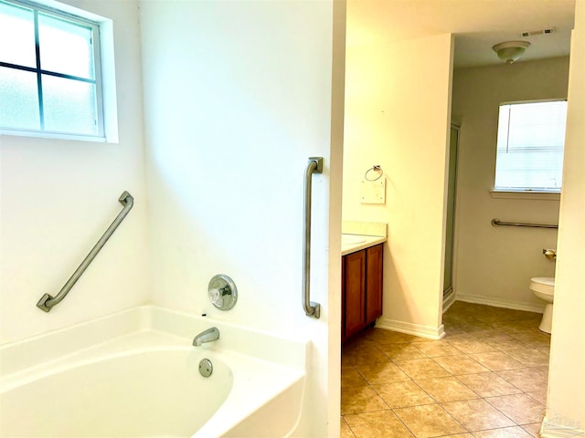 full bathroom featuring vanity, independent shower and bath, toilet, and tile patterned flooring