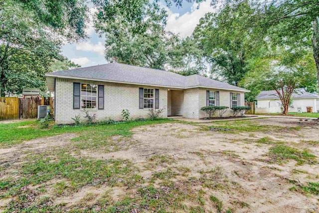 ranch-style house featuring cooling unit