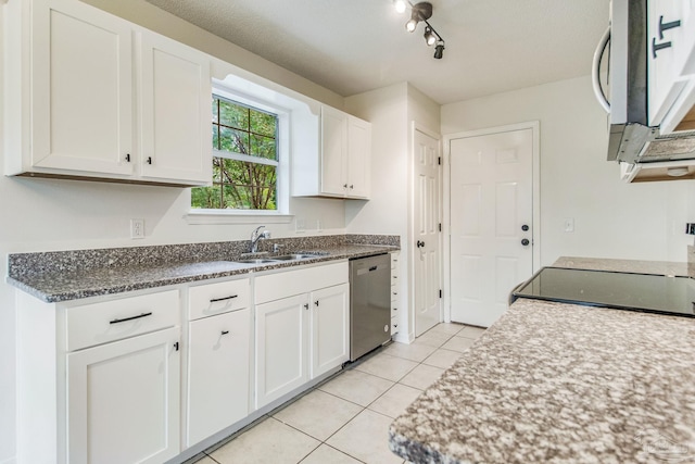 kitchen with light tile patterned flooring, sink, white cabinetry, and stainless steel appliances