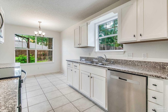 kitchen featuring a wealth of natural light, white cabinetry, dishwasher, sink, and a notable chandelier