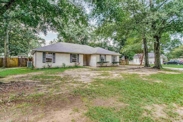 ranch-style home with a front yard and central AC