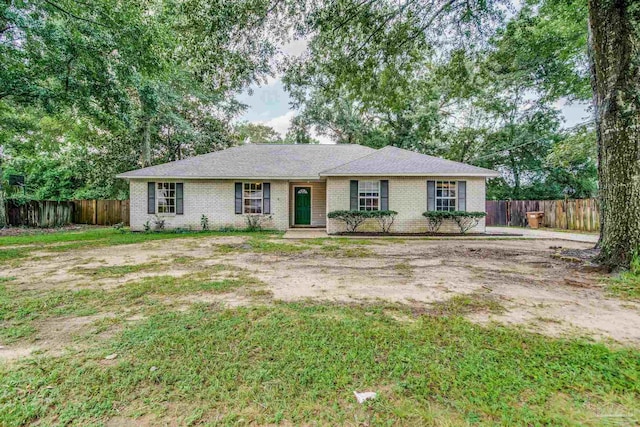 ranch-style house with a front yard