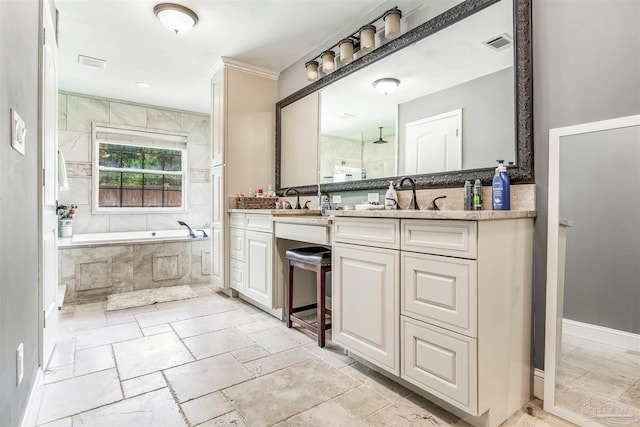 bathroom with vanity and separate shower and tub