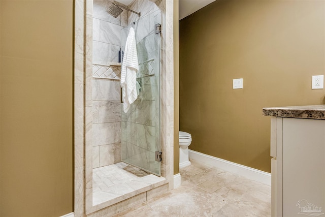 bathroom with vanity, toilet, and an enclosed shower