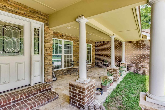 view of exterior entry featuring a porch