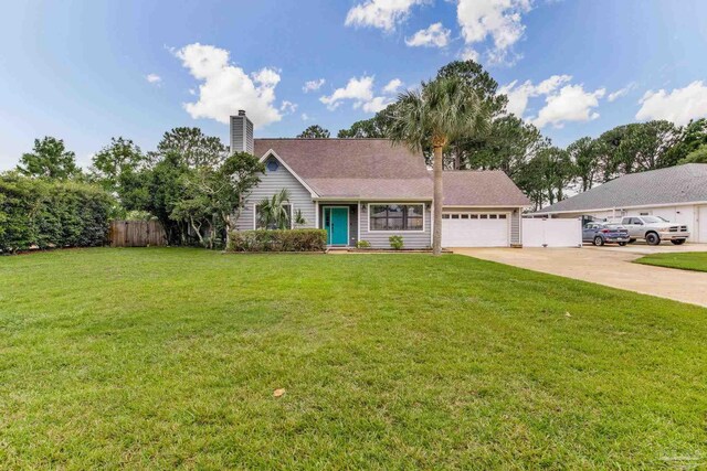 3905 Tiger Point Blvd, Gulf Breeze, FL 32563 - view of front of property with concrete driveway, an attached garage, and a chimney