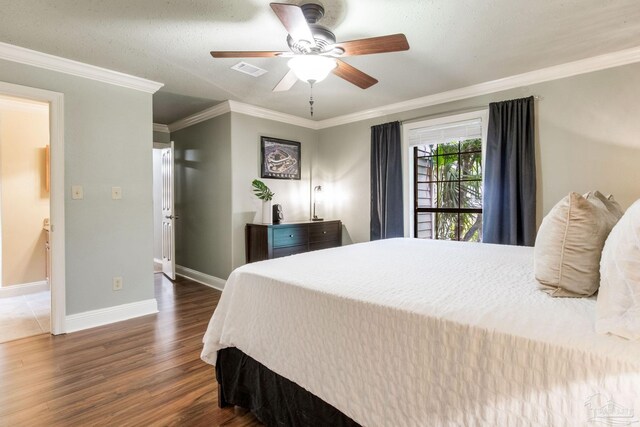 3905 Tiger Point Blvd, Gulf Breeze, FL 32563 - bedroom featuring wood finished floors, crown molding, baseboards, and a ceiling fan