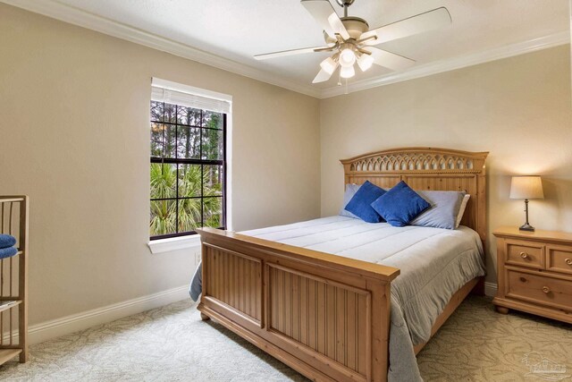 3905 Tiger Point Blvd, Gulf Breeze, FL 32563 - bedroom featuring light colored carpet, baseboards, crown molding, and a ceiling fan