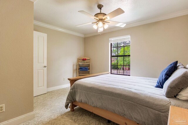 3905 Tiger Point Blvd, Gulf Breeze, FL 32563 - bedroom with baseboards, carpet, crown molding, and ceiling fan