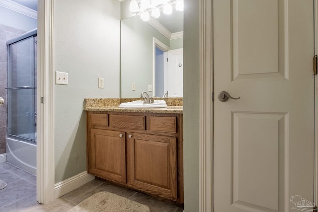 3905 Tiger Point Blvd, Gulf Breeze, FL 32563 - bathroom featuring crown molding, vanity, shower / bath combination with glass door, tile patterned flooring, and baseboards