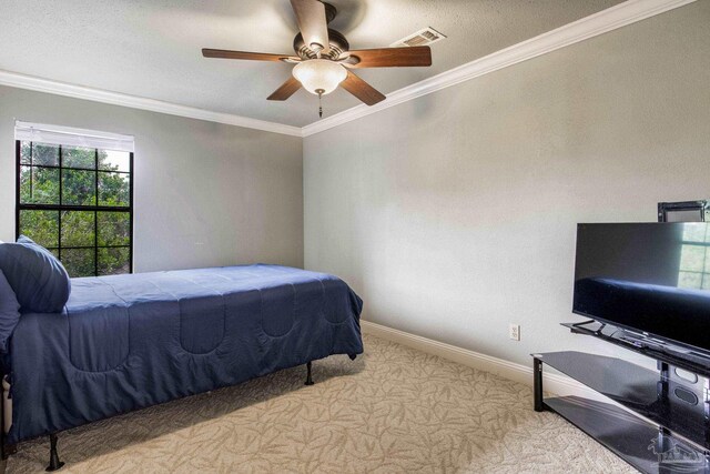 3905 Tiger Point Blvd, Gulf Breeze, FL 32563 - bedroom featuring carpet flooring, baseboards, crown molding, and a ceiling fan