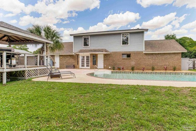 3905 Tiger Point Blvd, Gulf Breeze, FL 32563 - rear view of house featuring french doors, brick siding, a gazebo, and a deck