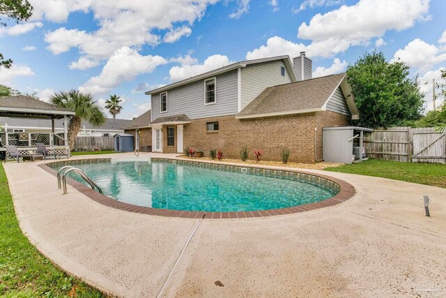 3905 Tiger Point Blvd, Gulf Breeze, FL 32563 - view of pool featuring a patio, a gazebo, and a shed
