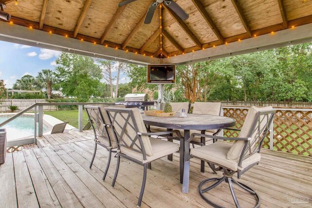 3905 Tiger Point Blvd, Gulf Breeze, FL 32563 - deck featuring a ceiling fan, outdoor dining area, a gazebo, and a fenced backyard