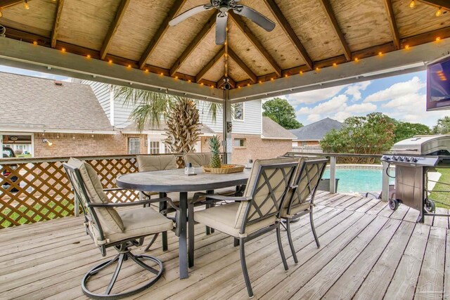 3905 Tiger Point Blvd, Gulf Breeze, FL 32563 - wooden terrace with a ceiling fan, a gazebo, outdoor dining space, and area for grilling