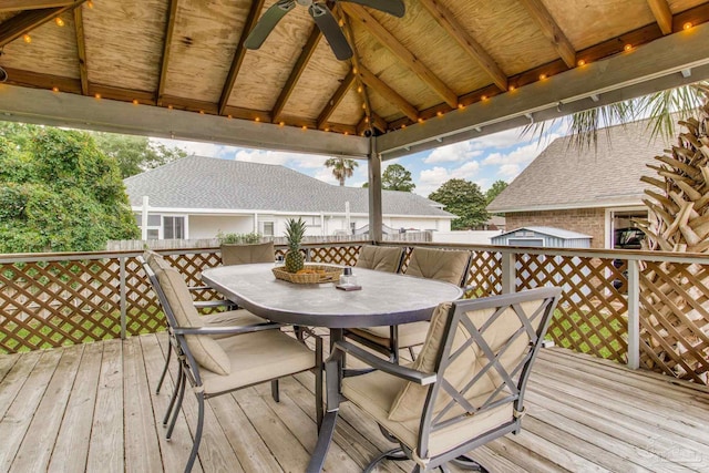 3905 Tiger Point Blvd, Gulf Breeze, FL 32563 - deck with ceiling fan, outdoor dining space, and a gazebo