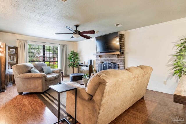 3905 Tiger Point Blvd, Gulf Breeze, FL 32563 - living room featuring wood finished floors, a brick fireplace, ceiling fan, crown molding, and baseboards