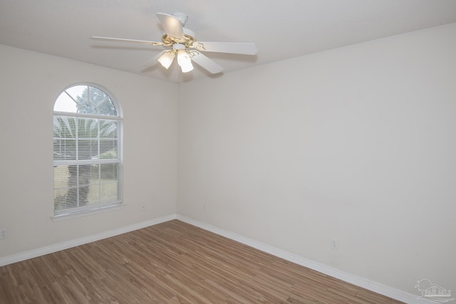 unfurnished room featuring hardwood / wood-style flooring and ceiling fan