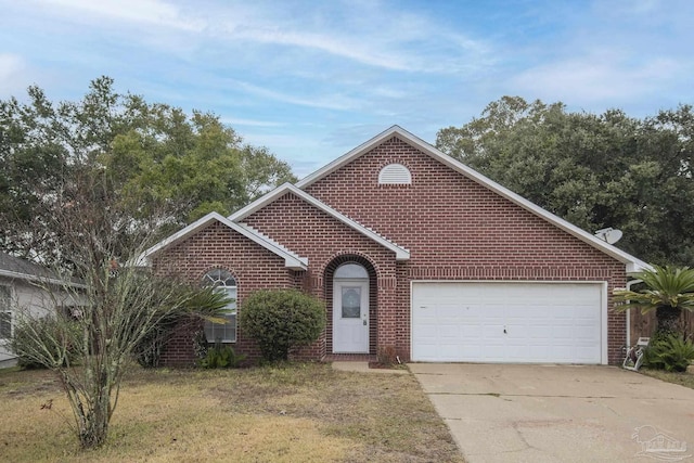 view of front of home featuring a garage and a front lawn