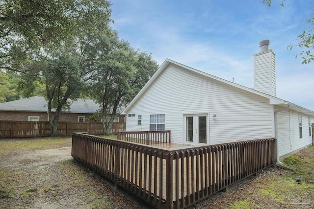 back of house with a wooden deck