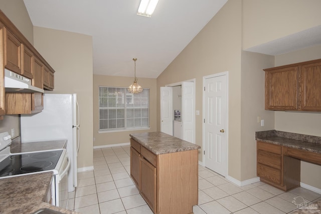 kitchen featuring electric range, a center island, light tile patterned flooring, and decorative light fixtures