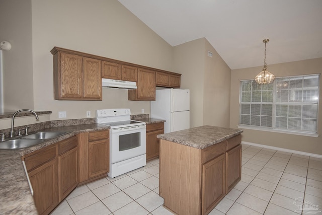 kitchen featuring white appliances, vaulted ceiling, sink, a chandelier, and a center island