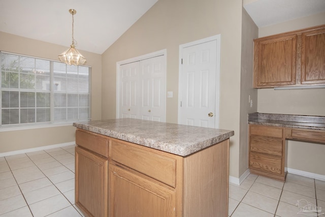 kitchen with light tile patterned floors, pendant lighting, an inviting chandelier, a center island, and lofted ceiling