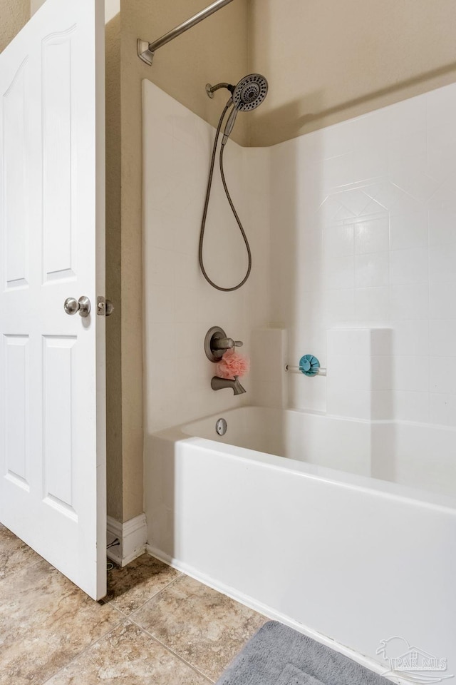 628 Mohegan Cir, Cantonment, FL 32533 - bathroom with washtub / shower combination and tile patterned flooring