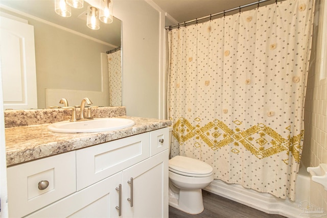 full bathroom featuring vanity, hardwood / wood-style floors, shower / bath combo, and toilet