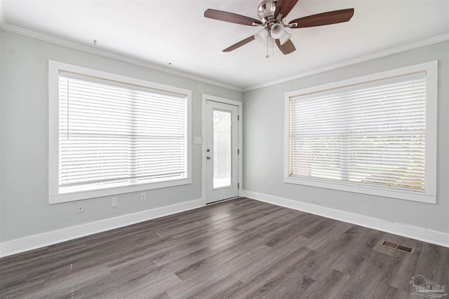 spare room with crown molding, dark hardwood / wood-style floors, and ceiling fan