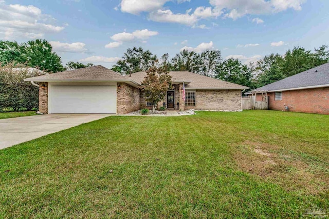 ranch-style home with a garage and a front yard