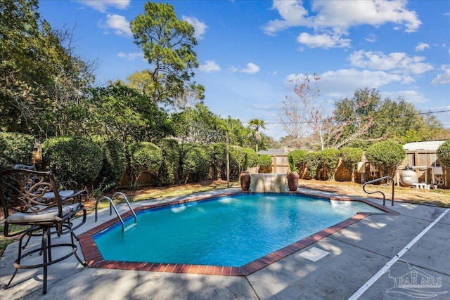 view of swimming pool with a fenced backyard, a fenced in pool, and a patio