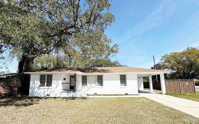 ranch-style home with concrete driveway, crawl space, a carport, and a front lawn